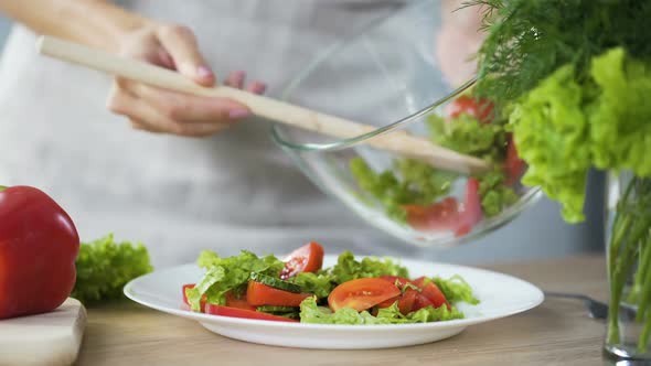 Lady Putting Fresh Salad on Her Plate, Going to Have Lunch, Healthy Eating
