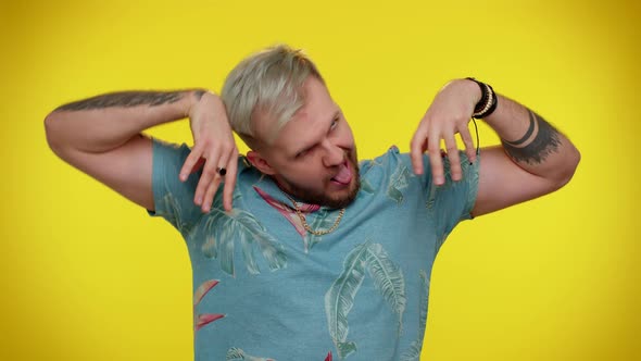 Crazy Man in Fashion Tshirt Demonstrating Tongue Out Fooling Around Making Silly Faces Madness