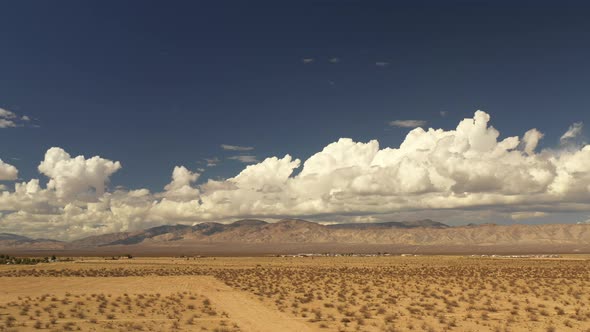 Aerial Hyper Lapse in the Mojave desert of storm clouds