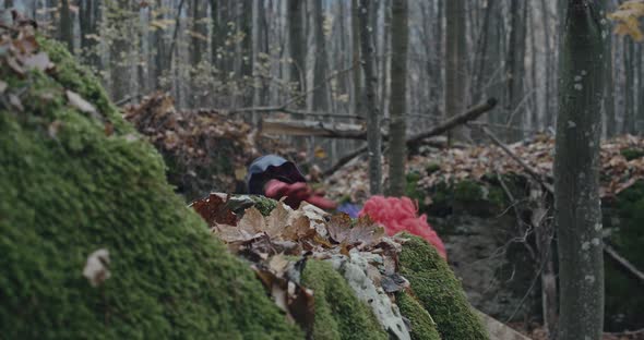 Scary Clown Looking At Camera From A Hill In The Forest