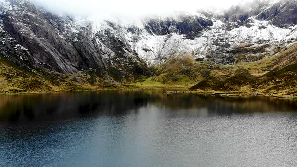 Drone footage of rock formation inCwm Idwal, a beautiful lake in National Park, North Wales on a ve