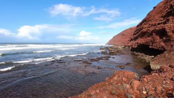 Ocean Waves in Rocky Coast In Sunny Summer Day in Morocco Nature Landscape