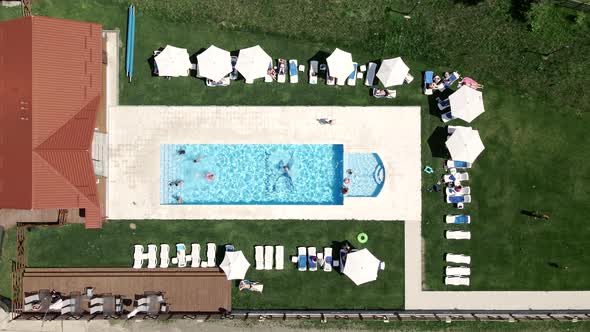 Aerial View of People Resting Near Pool