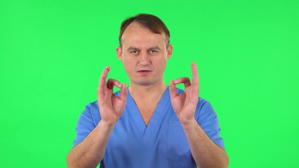 Medical Man Makes Sign Ok. Green Screen