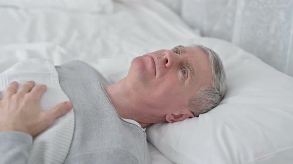 Worried Senior Old Man Awake in Bed Thinking