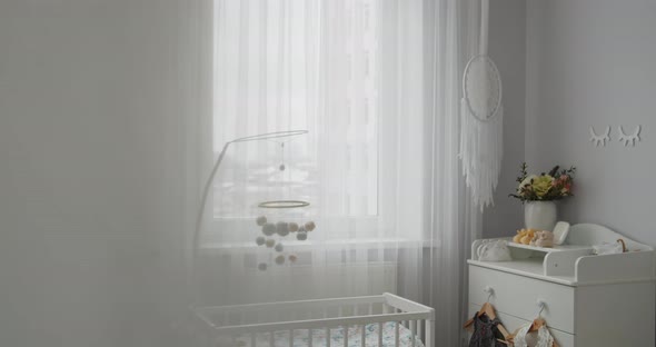 Stylish Bright Modern Baby Room Interior Crib Hanging Mobile Changing Table