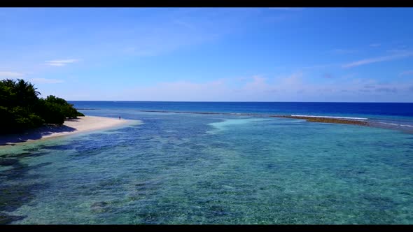 Aerial drone view tourism of perfect tourist beach break by turquoise water and white sand backgroun