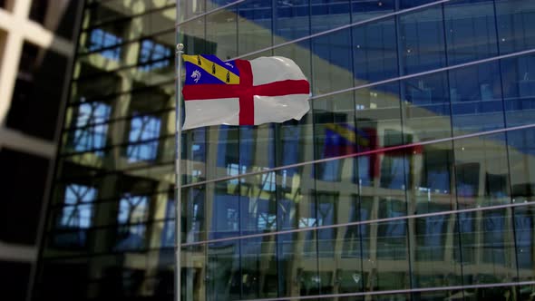 Herm Flag Waving On A Skyscraper Building