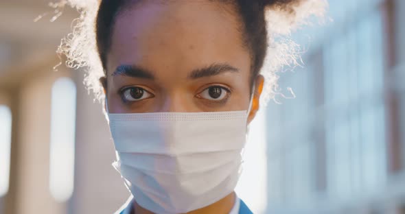 Portrait of Afro Young Businesswoman Wearing Medical Mask Standing Outside Office Building