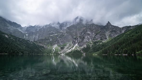 Timelapse of a mountain range covered with rolling rainy clouds. Peak of Mount Giewont in the Tatra 