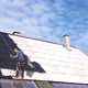 Worker sprays black paint on the roof - VideoHive Item for Sale