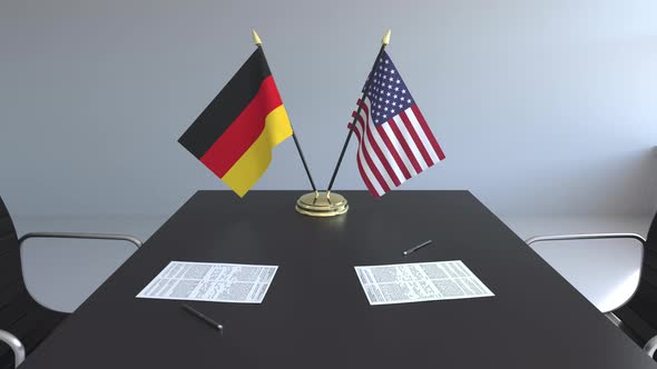 Flags of Germany and the United States on the Table