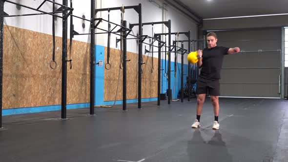 Handicapped sportsman exercising with kettlebell