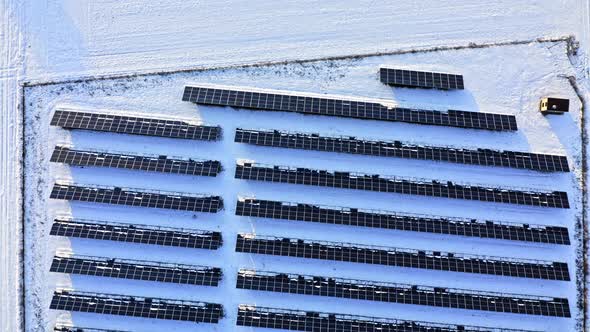 Snowy photovoltaic farm in winter. Alternative energy in Poland