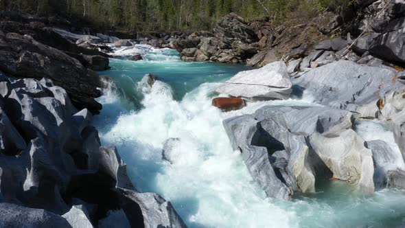 Fly above the surface of a mountain river Glomaga,Marmorslottet , Mo i Rana,Norway