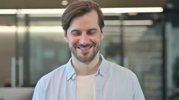 Mature Adult Man Shaking Head As Yes Sign