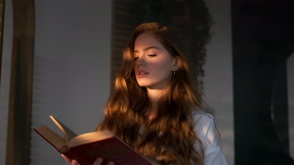 Pretty Girl With Long Hair Reads Book