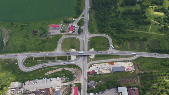 Aerial Drone View of Highway Multilevel Junction Road with Moving Cars Near to City Haos