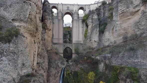 Ascending aerial of stunning arch Puente Nuevo bridge in Ronda, Spain