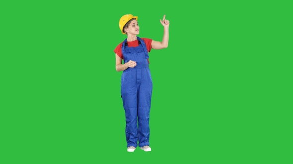Young smiling Worker woman presenter pushing imaginary