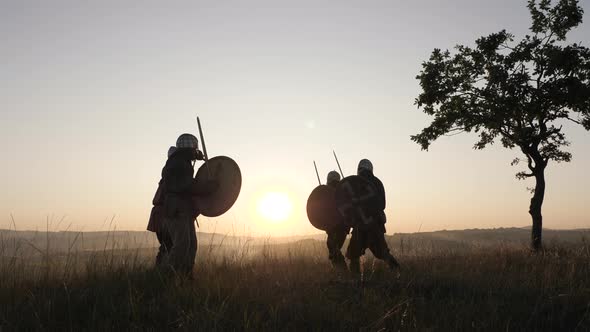 Warriors fighting at sunset