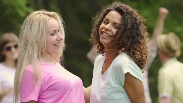 Excited Female Friends Hugging and Having Fun at Outdoor Party, Togetherness