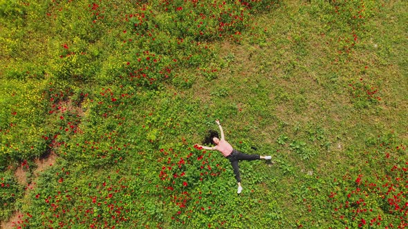 Girl Lays On Ground In Spring Relaxed Top View