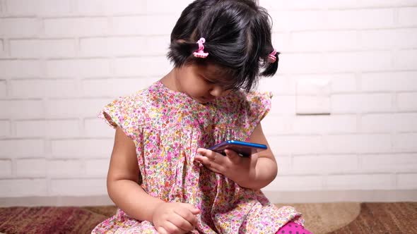 Child Girl Watching Cartoon on Smart Phone