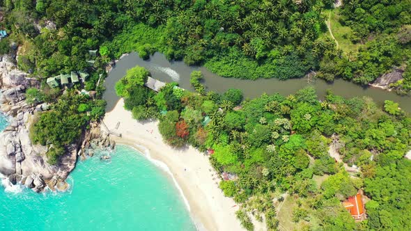 Wide angle flying tourism shot of a sandy white paradise beach and turquoise sea background in hi re