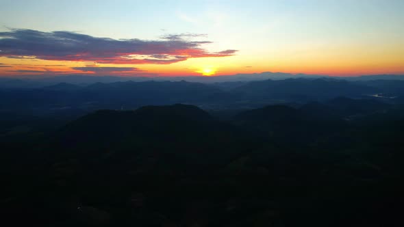 4K Aerial drone of Epic mountain with a colorful sunset