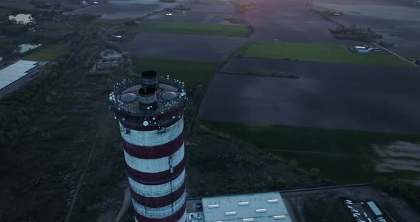 Aerial view, circular camera movement approaching the chimney.