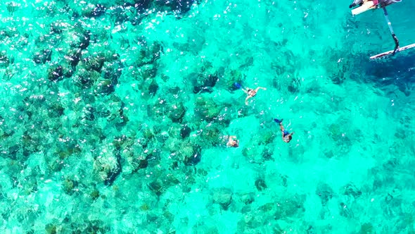 Aerial top down landscape of beautiful resort beach time by blue green ocean and clean sandy backgro