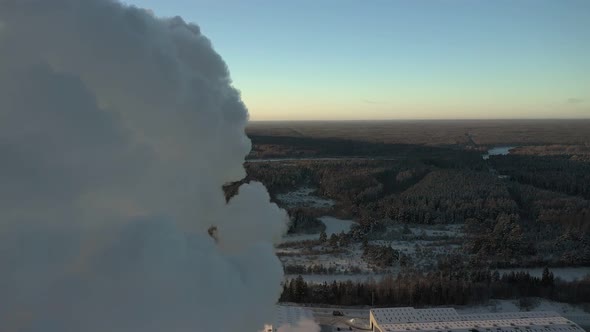 Clouds of Thick Smoke are Pouring Out of the Plant's Pipes