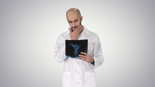 Doctor Examining a Lung Radiography While Walking on Gradient