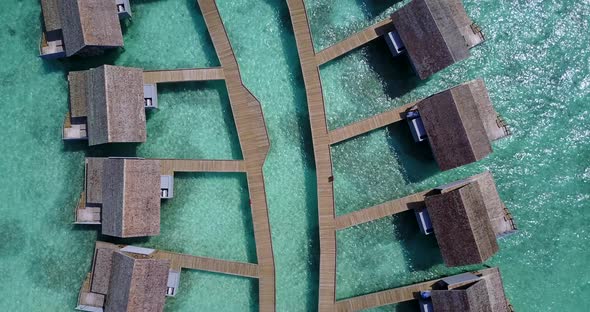 Wide angle drone travel shot of a summer white paradise sand beach and aqua turquoise water backgrou