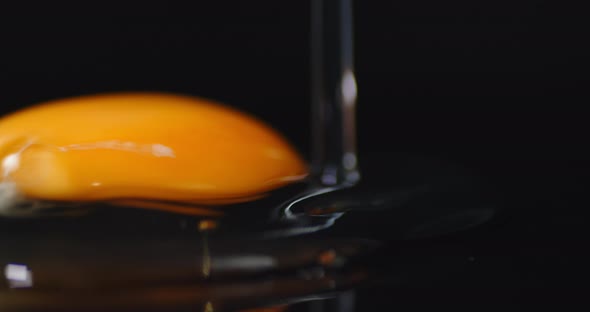 One Liquid Raw Egg Falls on the Table.