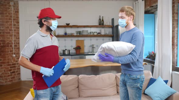 Man Receiving Deliver From Courier in Mask and Gloves