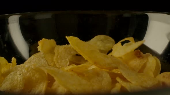 Potato Chips Spilling Into Bowl