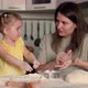 Cheerful Mom and Daughter are Fooling Around While Cooking Sweet Pastries From Dough in the Kitchen - VideoHive Item for Sale