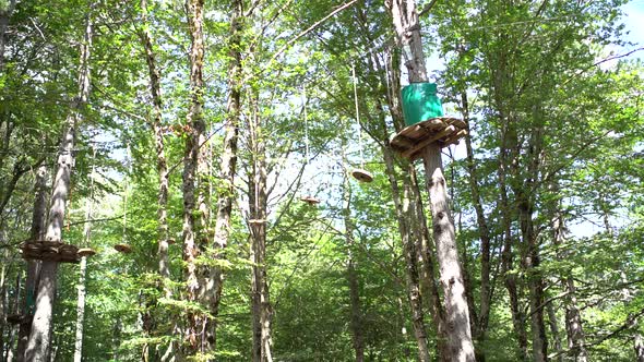 Adventure Park with Circle Grounds and Ropes on the Trees