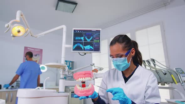 Patient Pov of Dentist Showing Correct Way of Cleaning Teeth