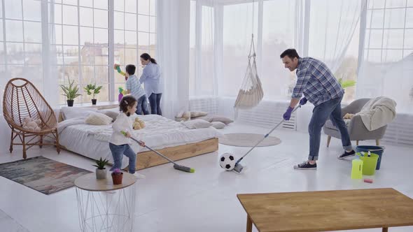 Friendly Family Cleaning Domestic Room with Fun