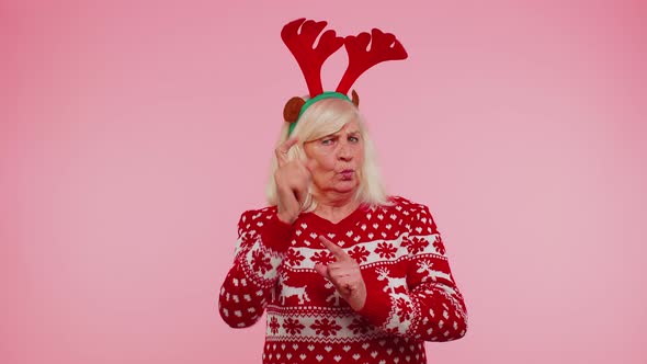 Displeased Senior Christmas Old Woman Gesturing Hands with Displeasure Blaming Scolding for Failure