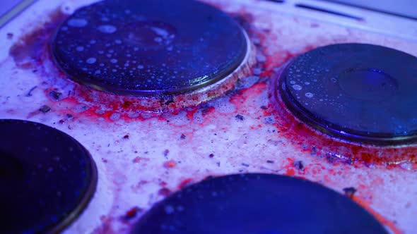 Smooth Movement of a Parallax Camera Over a Very Dirty Old Kitchen Electric Stove in Blue