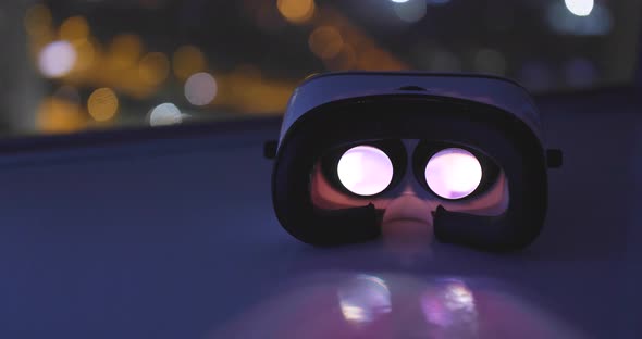 Playing movie inside VR device with city background at night