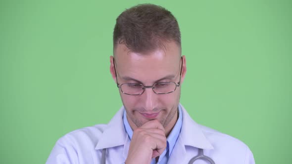 Face of Stressed Man Doctor Thinking and Looking Down