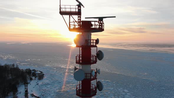 Top of Communication Tower Against Sunrise in Winter