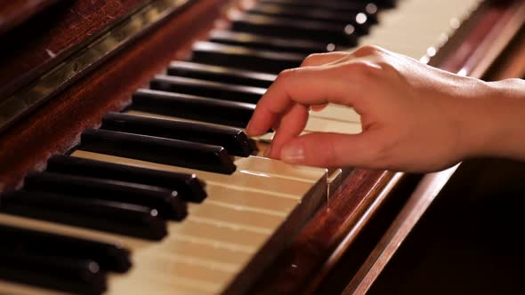 Woman Playing on Vintage Wooden Piano