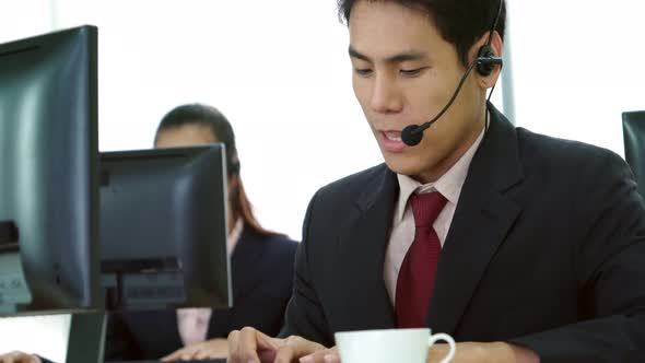 Business People Wearing Headset Working in Office