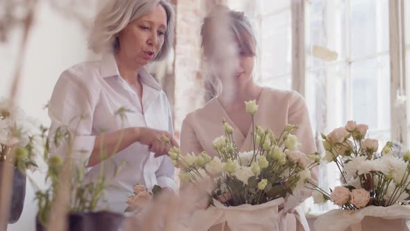 Two Female Florists Making Flower Compositions Together